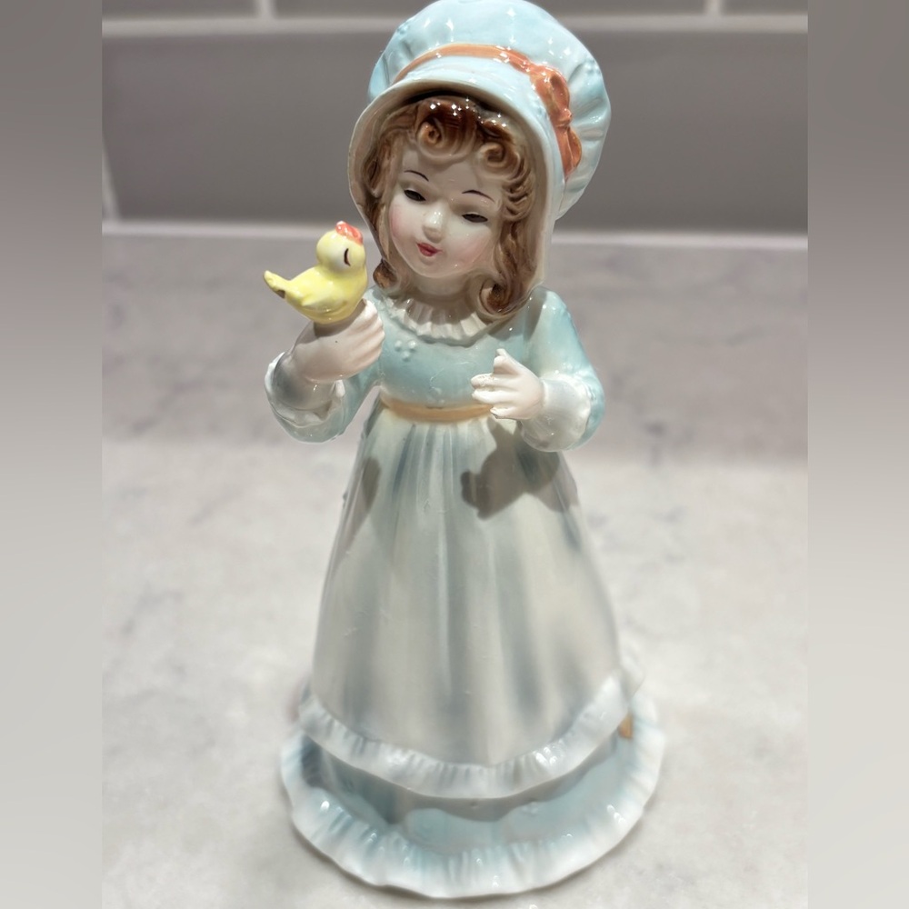 Josef Original girl in blue bonnet and apron holding yellow bird RARE